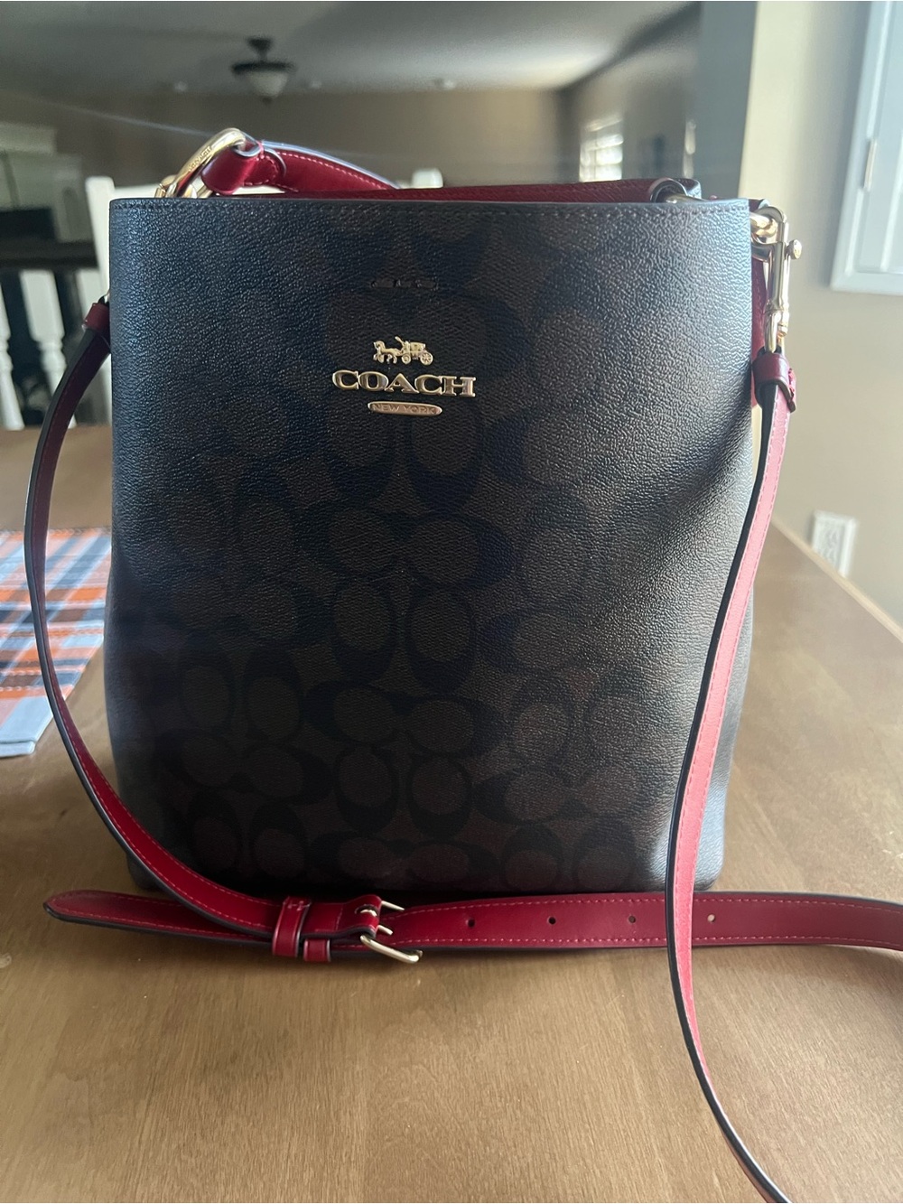 Coach Brown Signature Canvas Crossbody with Red Strap